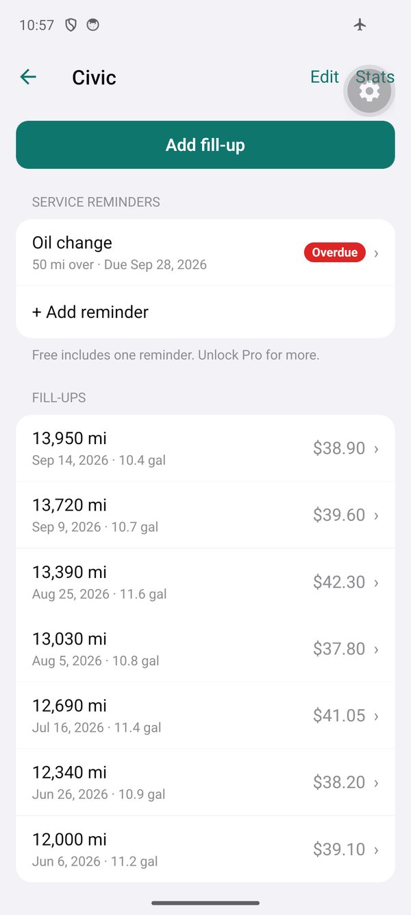 Fuel Log vehicle screen on Android with an overdue oil change reminder and a list of fill-ups